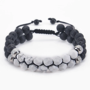 Close-up of double-layer hematite bracelet with lava stone and marble beads on black cord