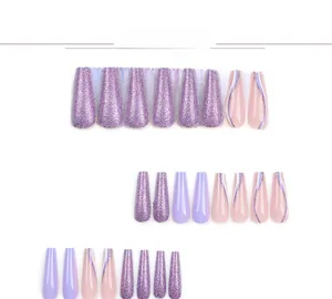 Detailed view of long coffin press on nails in purple glitter and lilac solid colors