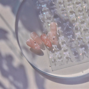 Iridescent aurora bow nail stickers with shell light effect and 3D butterfly designs
