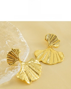 Detail of 18K vacuum plated golden ginkgo leaf earrings with fine radial vein texture