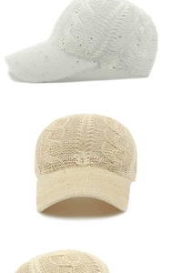 Detailed view of the hollow-out knitted texture with silver sequins on summer baseball cap