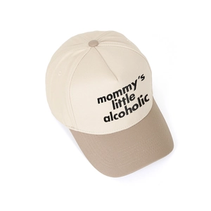 Detail of two-tone baseball cap with Mommy's Little Alcoholic slogan on beige crown