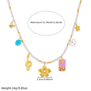 Colorful beaded necklace with golden butterfly, flower, and music note pendants