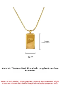Detail view of gold bar pendant with GOLD engraving on titanium steel snake chain
