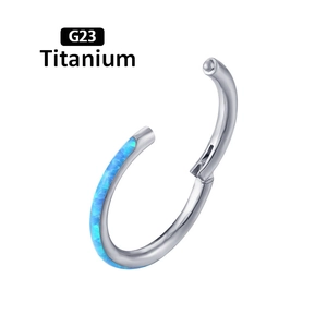 Macro detail of G23 titanium silver ring set with vibrant blue opal stone in macro view
