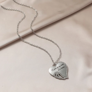 Silver angel wing heart necklace engraved with A piece of my heart is in heaven