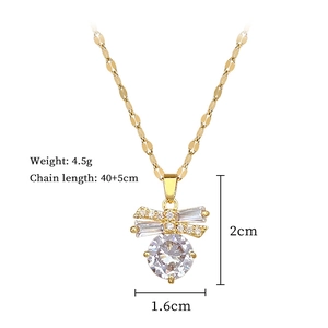 Detail of gold butterfly necklace featuring a large round zircon stone and size specs