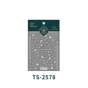 Macro detail of white star and moon embossed nail art stickers with 3D texture details