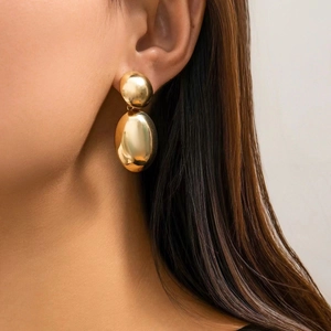 Polished gold geometric oval drop earrings for women with double irregular hoops design