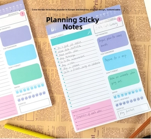 Detail of daily planner notepad with colorful sections for goals and habit tracking