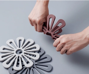 Macro detail of flexible flower-shaped silicone heat insulation mat showing soft material