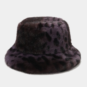 Detailed texture of purple leopard print faux fur on a stylish winter bucket hat