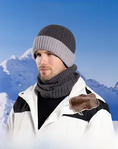 Close-up of thick brown fleece lining inside a grey winter knit beanie and scarf set