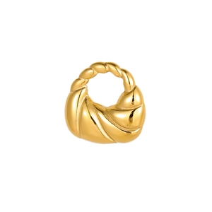 Close-up of golden chunky twisted hoop earrings with glossy metallic finish and texture