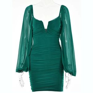 Detail of V-neckline and mesh lantern sleeves on this slim fit dark green mini dress