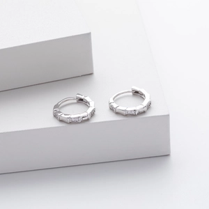 Detailed close-up of S925 sterling silver bamboo hoop earrings with micro zircon inlays