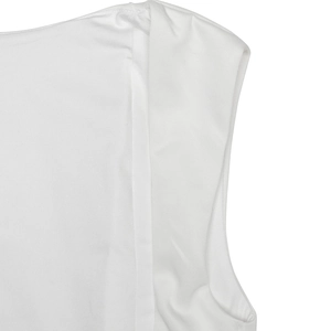 Macro shot showing high-quality stitching and cotton fabric texture on white sleeveless dress