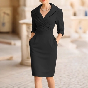 Elegant black V-neck slimming dress with long sleeves and waist-cinching detail