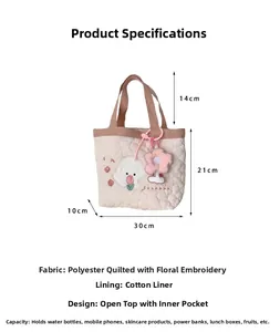Detailed view of beige quilted tote bag with cute dog embroidery and 30x21cm size guide