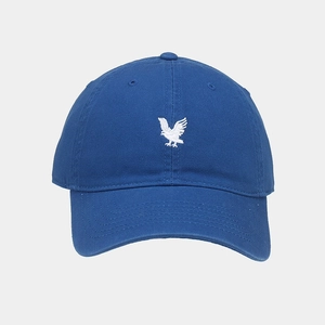 Detailed close-up of white eagle embroidery on navy blue cotton baseball cap crown
