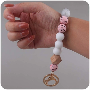 Silicone leopard and pink terrazzo bead keychain bracelet with natural wooden bead