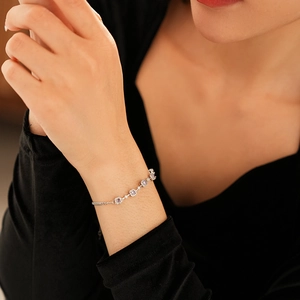 Elegant purple zircon square bracelet in silver finish shown on a woman wrist