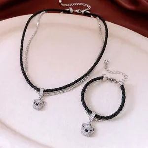 Luxury rhinestone bear pendant necklace and bracelet jewelry set on velvet display