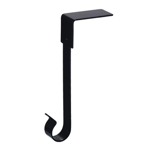 Close-up of a sturdy black metal Christmas stocking holder for fireplace mantels