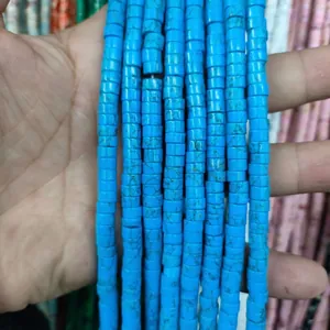 Close-up of blue marble textured cylindrical natural stone spacer beads for DIY jewelry