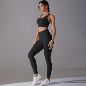 Detailed side view of high-waisted black yoga set showcasing firm compression and body shaping