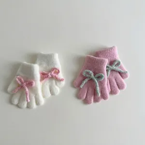Cute plush knitted gloves for girls with bowknot decor, warm winter five-finger accessories