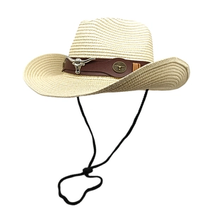 Straw western cowboy hat with brown leather band and silver bull head ornament