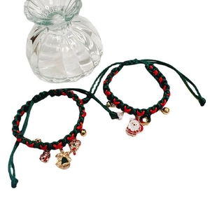 Handmade Christmas woven bracelets with Santa and bell charms in red and green colors