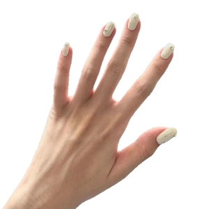 Elegant beige press-on nails with small pearls and rhinestones decoration in almond shape