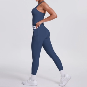Detail of high-waist navy yoga leggings featuring a functional side pocket with phone
