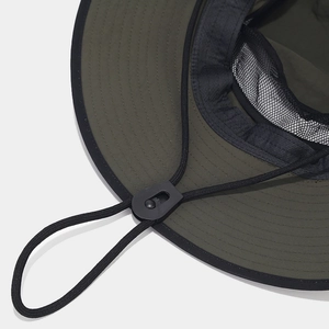 Detail view of olive green waterproof hiking hat with breathable mesh and adjustable chin strap
