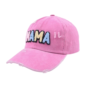 Detailed view of pink washed canvas baseball cap with MAMA embroidery and distressed accents