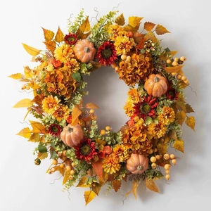 Autumn harvest wreath featuring orange pumpkins, sunflowers, berries, and maple leaves