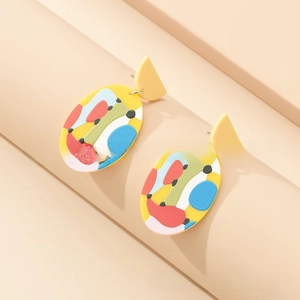 Abstract pop art style colorful acrylic drop earrings displayed on geometric background