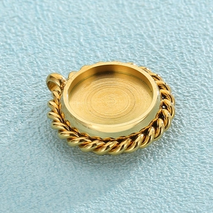 Macro shot of gold round twisted bezel tray pendant for DIY jewelry making