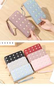 Detailed view of women's long PU leather wallet featuring embroidered floral patterns