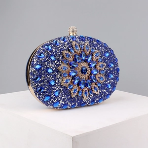 Macro shot of blue rhinestone evening bag with intricate floral crystal pattern