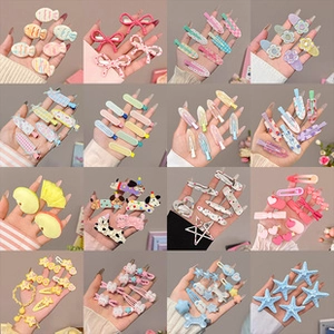 Detailed grid view of assorted colorful hair clips with floral and cartoon patterns