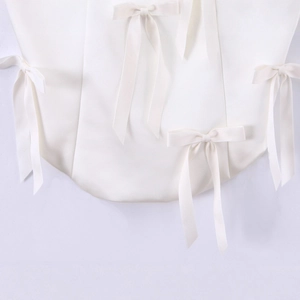 White halter top with multiple bow decorations in high-quality satin fabric