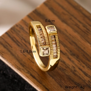 Macro detail of 18K gold plated bypass ring with zircons showing dimensions and weight