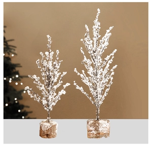 Close-up of artificial frosted pine Christmas tree set with natural wooden base