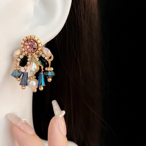 Vintage style drop earrings with pink crystals and pearls on a gold-plated base