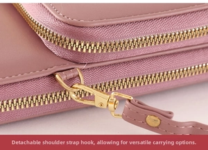 Detail of the detachable gold metal hook and zipper on the lilac crossbody bag