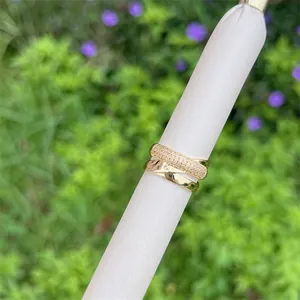 Crossed double layer 18K gold plated ring with shimmering zircon stones in a minimalist design