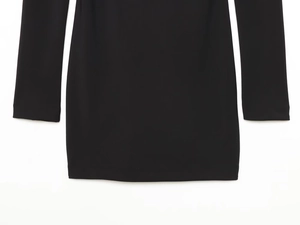 Detail of the soft elastic fabric texture and neat hem on this black long sleeve dress